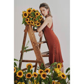 Silk slip dress with flared hem and double-strap open back for a sleek, modern silhouette